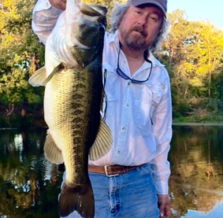 Ray McKinney with a 10 pound beauty he caught at Laneville - Hidden Springs Ranch.