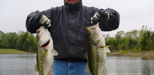 Cortney Coe holds two nice bass at Longbranch Yates Place.