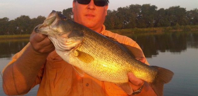 Mark Levock holds a 7 pounder caught at Van Alstyne JerMar Lake in mid-summer.