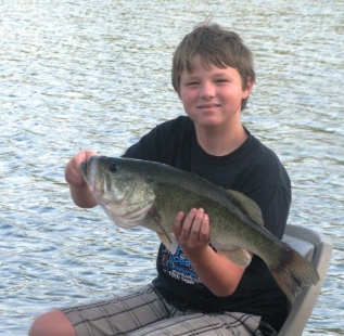 Owner, Steve Alexander's oldest son Ty, holds his personal best. Caught mid summer at Sash Fannin Farms.