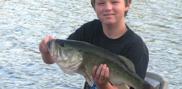 Owner, Steve Alexander's oldest son Ty, holds his personal best. Caught mid summer at Sash Fannin Farms.