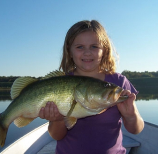 Brad Sheilds daughter landing a fish nearly as big as she is.